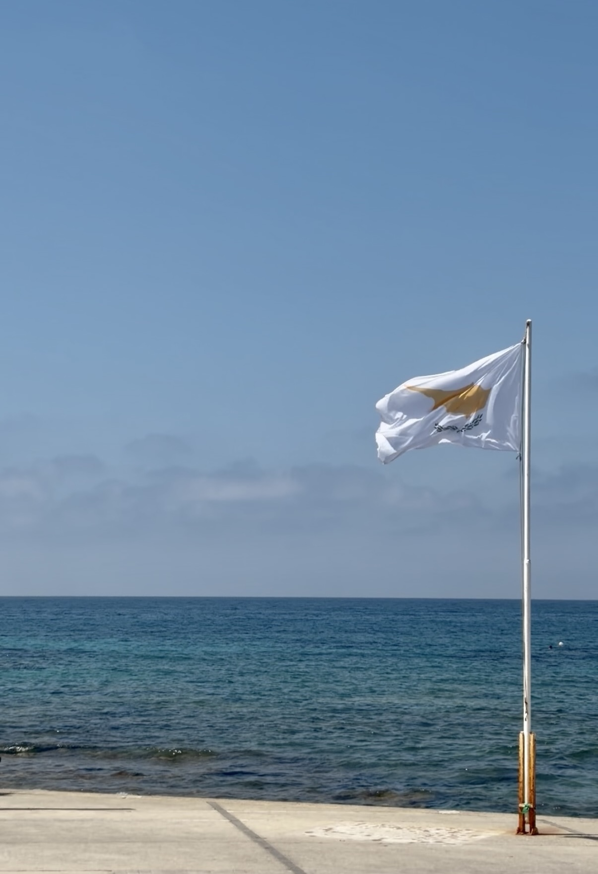 The flag of Cyprus overlooking Pafos Harbour